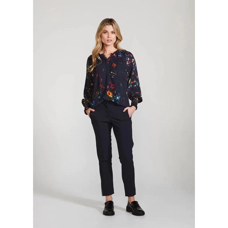 Contemporary Duchess prin. Loose-fitting silhouette. Gathered neckline. Shirred cuffs. Rouleau loops at the front opening. Self-covered buttons with metal dragonfly detail. Size: 10 - 16. 51% Viscose 49% Rayon. Hand wash