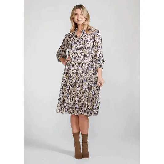 Blush front view. Simple elegant watercolour floral print. Loose-fitting silhouette. Bodice pin-tucks. Lightly gathered skirt. Shirt collar and shirred cuff. This dress includes a separate 100% rayon slip dress with adjustable straps. Size: 8 – 16. 100% Viscose. Hand wash