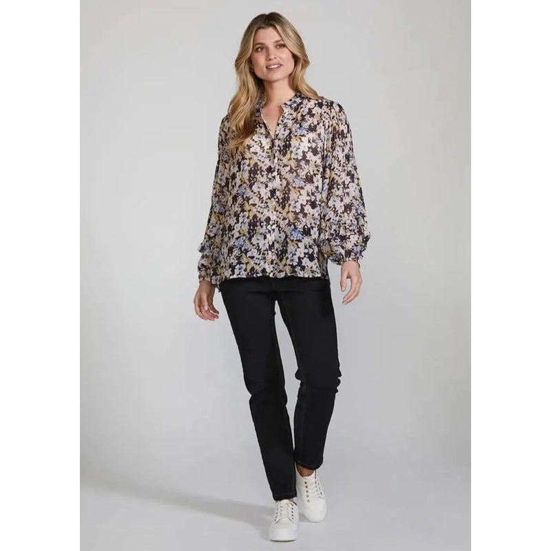 Front view Blush. The Park Shirt is romantic and sophisticated. Subtle watercolour floral print. Softly gathered frill detailing at the neckline and sleeves. Size 8 - 16. 100% viscose. Hand wash.