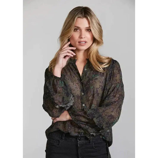 Front view Moss. The Park Shirt is romantic and sophisticated. Subtle watercolour floral print. Softly gathered frill detailing at the neckline and sleeves. Size 8 - 16. 100% viscose. Hand wash.